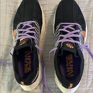 Nike Women's Black Sneakers with Orange Accents and Purple Laces